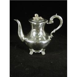 A William IV silver coffee pot and cover with a melon knob, scrolled handle and cast feet 1833, a...
