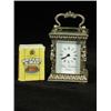 Image 1 : A modern miniature silver carriage clock in a cast case, the enamel dial inscribed 'Chas Frodsham...