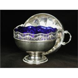 A WMF plated bowl, with a pierced rim, on a circular foot, with a plated dish (2), 21cm diameter...