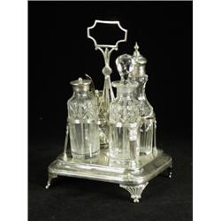 A George III silver cruet stand with four glass bottles, 1808, 21.5cm high Est. 250/350...