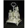 Image 1 : A George III silver cruet stand with four glass bottles, 1808, 21.5cm high Est. 250/350...