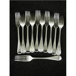 Eleven George III silver dinner forks, London 1818, each with a serpents head crest, for McBeth E...