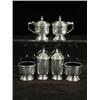 Image 1 : A six piece silver cruet set, of cylindrical shape with stepped lids, Sheffield 1945 Est. 250/300...