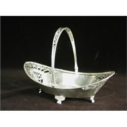 A silver swing handle oval cake basket with decorative pierced sides, Sheffield 1963, 20cm long E...