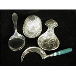 A novelty 'Jockey Cap' silver caddy spoon, Sheffield 1938, two other caddy spoons and a silver an...