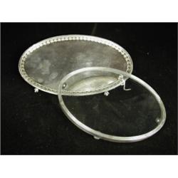 A George III Sheffield plated oval teapot stand and a similar silver and glass stand Est. 80/120...