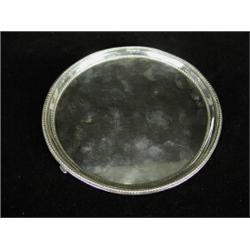 A George III silver circular salver, London 1782, 15cm diameter Est. 150/250...