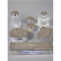 Seven Victorian silver mounted dressing table boxes and bottles, London 1871, maker W.N., (A/F) E...