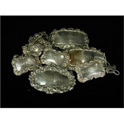 Seven various silver embossed decanter labels, various dates Est. 150/250...