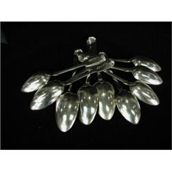 A pair of George III silver table spoons, London 1791, four Victorian dessert spoons, London 1838...