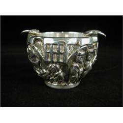 An unusual white metal Eastern embossed pot, (converted to an ashtray), 20th century, 7cm high Es...