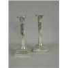 Image 1 : A pair of weighted silver candlesticks with stop fluted columns and stepped bases, with presentat...