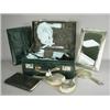 Image 1 : A ladies leather fitted dressing case, with silver backed brushes, hand mirror, a large silver ea...