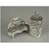 Image 1 : A silver pin cushion in the form of a settee, 1901, 11cm long, and a glass scent bottle in a silv...