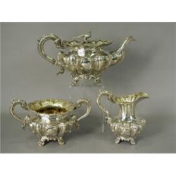 An early Victorian silver teaset, comprising a teapot, milk jug and twin handed sugar bowl, of sq...