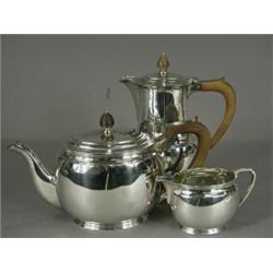 A George VI silver three piece tea set, hallmarked Sheffield 1944, 38ozs (monogrammed) Est. 200/3...