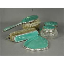 A late George V Art Deco silver and enamel seven piece dressing table set, hallmarked Birmingham...