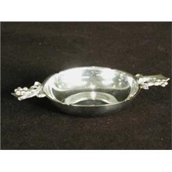 A silver wine taster by R. E. Stone, with cast handles and a hammered finish, London 1946, 9cm di...