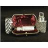 Image 1 : Three silver scent bottles: One in a fitted case, 1900 One glass in a silver sleeve, 1914 and One...