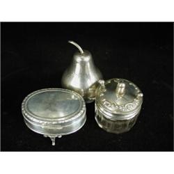 A silver string box of pear shape. 1909, 9cm high, a silver jewellery box. 1913 and a glass table...