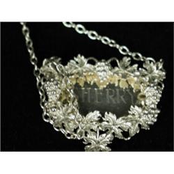 A modern silver decanter label, engraved 'Sherry' in a cast white metal border, 1979 Est. 50/80...