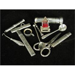 Twelve silver items including: three pencil holders, a propelling pencil and a miniature chair Es...