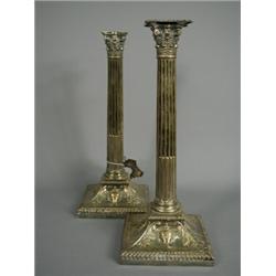 A pair of 19th century Sheffield plate candlesticks with corinthian columns and decorative shaped...