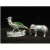 Image 1 : Two silver pin cushions: one in the form of an elephant 1910, 4cm long and one in the form of a g...