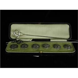 A cased set of six silver buttons with cast floral decoration 1900, and three Art Nouveau hat pin...