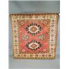 Image 1 : A modern rose ground handmade woollen Chechen rug, 1.68 x 1.64m Est. 250/300...
