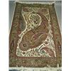 Image 1 : A Sarouk rug, the cream field with large floral botehs within a moss green and floral border<b...