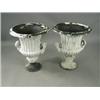 Image 1 : A pair of 19th century cast iron garden urns of campana shape, 74cm high Est. 800/1000...
