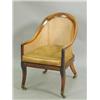 Image 1 : A Regency rosewood bergere armchair, with a later loose button leather seat, stamped W. Huxley...