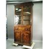 Image 1 : An early 19th century mahogany secretaire bookcase, the doors with carved scroll and fan decor...
