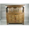 Image 1 : A late 17th/early 18th century oak press cupboard, the top section with two carved panelled do...