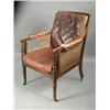 Image 1 : A mid 19th century mahogany bergere library chair, with leather stuffed arms, removable seat a...