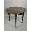 Image 1 : A George III oval mahogany table, the two leaf top on four turned club foot legs with lappet c...