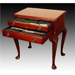 An Edwardian two drawer table canteen of one hundred and two pieces of matched Kings pattern cutl