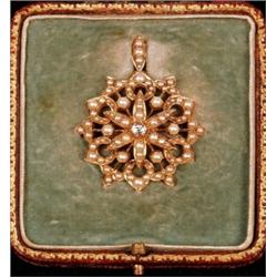 A late Victorian brooch/pendant, set with diamond and split pearls, stamped 15ct, in original fit