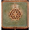 Image 1 : A late Victorian brooch/pendant, set with diamond and split pearls, stamped 15ct, in original fit