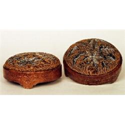 A pair of mid Victorian walnut and beadwork upholstered foot stools, circa 1860, of rounded form