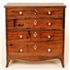 Image 1 : An early 19th Century mahogany miniature chest of four graduated long drawers, turned ivory handl