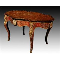 A mid Victorian boulle, ebonised and ormolu mounted writing table, circa 1860, the quatrelobed re