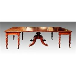 A George IV Irish mahogany dining table, circa 1825, with rounded corners, concave rim and plain