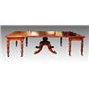 Image 1 : A George IV Irish mahogany dining table, circa 1825, with rounded corners, concave rim and plain