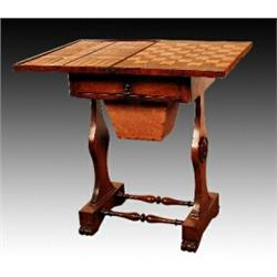 A late George IV rosewood work and games table, circa 1830, the hinged top opening to reveal a sw