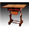 Image 1 : A late George IV rosewood work and games table, circa 1830, the hinged top opening to reveal a sw