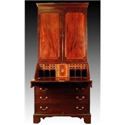 A George III mahogany bureau bookcase, circa 1785, the concave dentil cornice above two mahogany