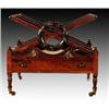 Image 1 : A George IV rosewood canterbury, circa 1825, the three divisions of X frame slat form centring a