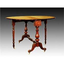 A mid Victorian walnut Sutherland table, circa 1865, of oval form on turned ring and baluster sup
